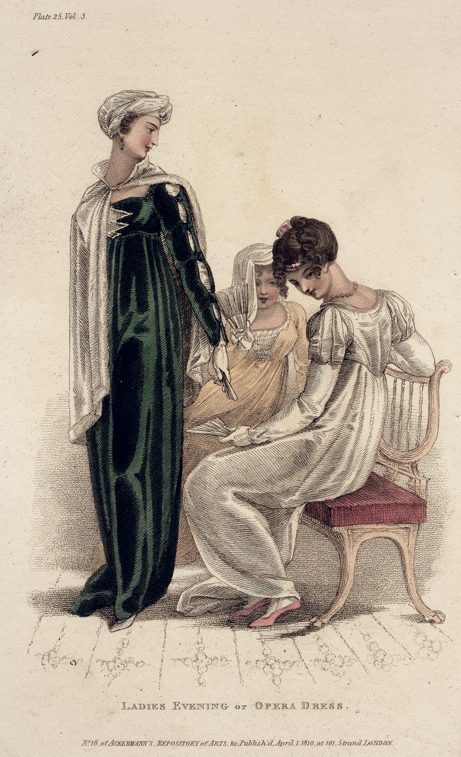 Figure 3.2 A colored fashion plate depicting three women in ladies’ evening dress: the first, left, standing, wears a green velvet empire waist gown with cut sleeves to reveal white fabric beneath; the second, middle, seated, wears a yellow empire waist dress with a white bodice; the third, right, seated, wears a white empire waist dress with a train and puff sleeves.